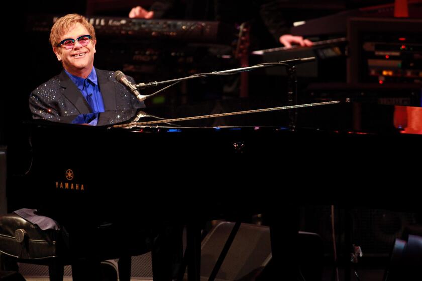 Elton John, seen here performing at Bovard Auditorium at USC in the fall of 2013, is top-billed at the 2014 edition of the Bonnaroo Music and Arts Festival.