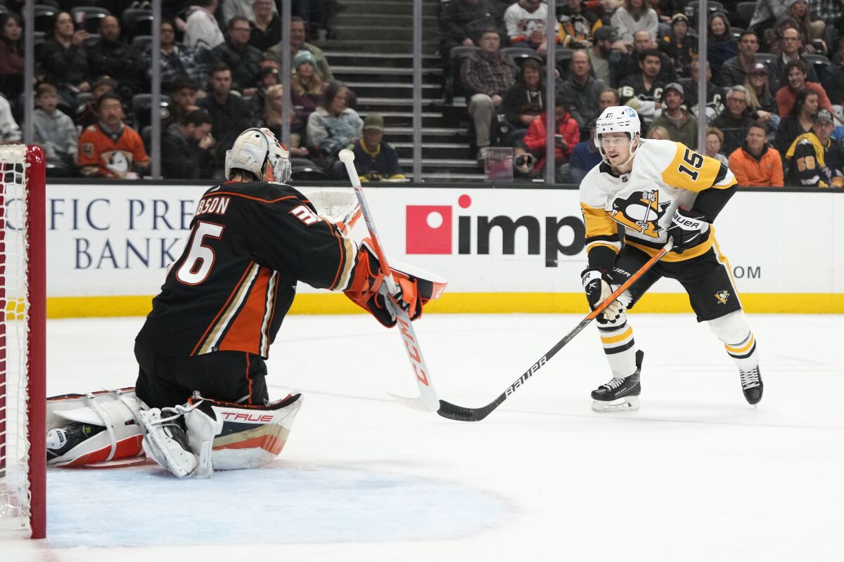 Ducks goalie John Gibson makes a save against the Penguins' Josh Archibald (15) during the second period Feb. 10, 2023.