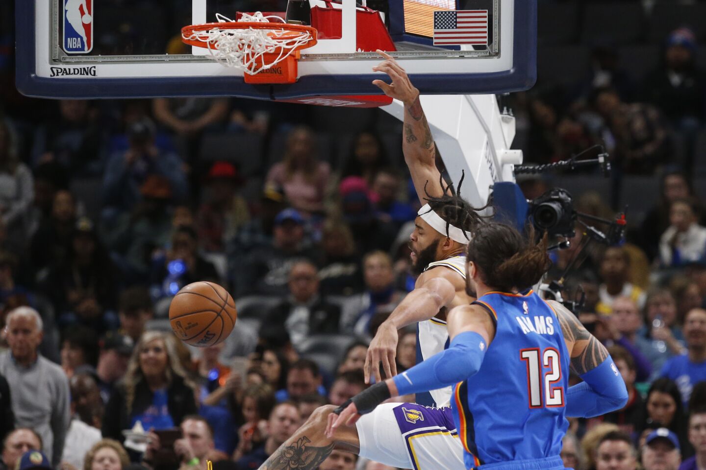 Lakers center JaVale McGee dunks in front of Thunder center Steven Adams (12) during the second half of a game Jan. 11.