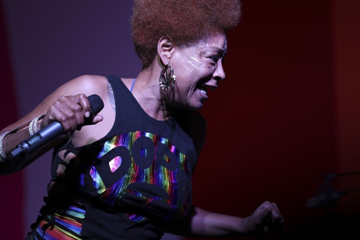 A performer onstage holding a microphone
