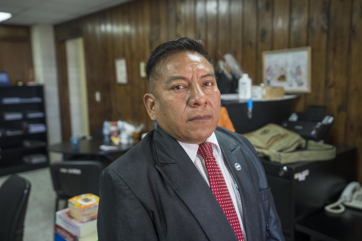 Judge Pablo Xitumul poses for a portrait at his office in Guatemala City, Tuesday, Oct. 5, 2021. Xitimul, one of Guatemala’s most prominent judges, is facing the possibility of losing his immunity, which would open him to a long list of legal actions brought by relatives of people he has sentenced in a number of high-profile cases. (AP Photo/Moises Castillo)