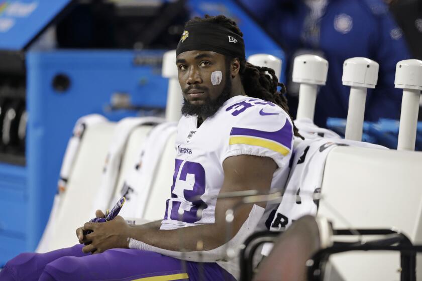 Minnesota Vikings' Dalvin Cook sits on the bench during the second half of an NFL football game against the Seattle Seahawks, Monday, Dec. 2, 2019, in Seattle. (AP Photo/John Froschauer)