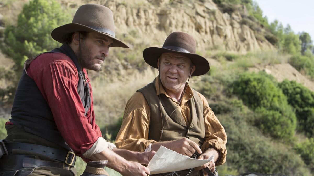 Joaquin Phoenix, left, and John C. Reilly in the movie "The Sisters Brothers."