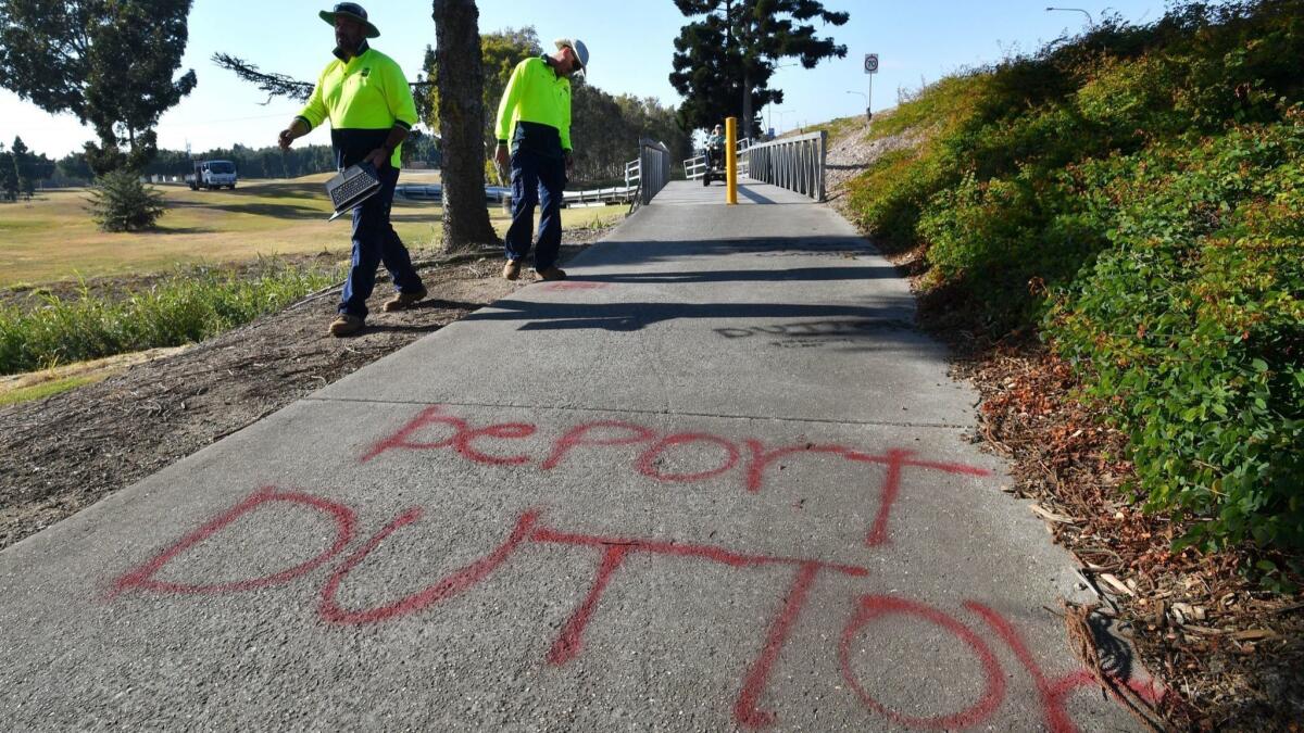 Anti-Peter Dutton graffiti appears on a bike path near his office in the suburb of Strathpine, north of Brisbane in Queensland, Australia, on Aug. 24, 2018.