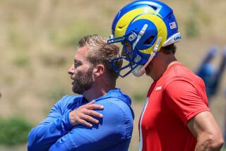 Rams  coach Sean McVay talks with quarterback Matthew Stafford at the last day of OTA practice at Cal Lutheran University.