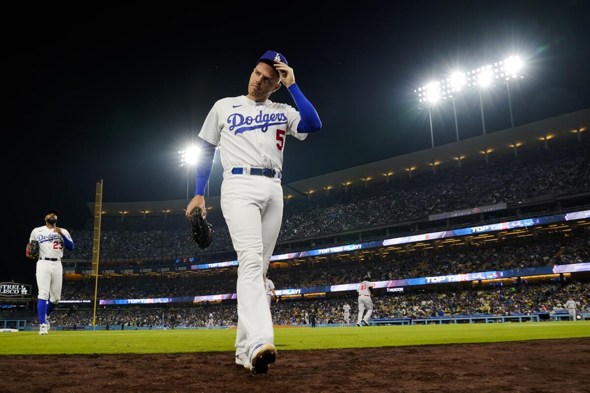 Dodgers first baseman Freddie Freeman walks to the dugout during a 5-1 loss to the Minnesota Twins on Tuesday night.