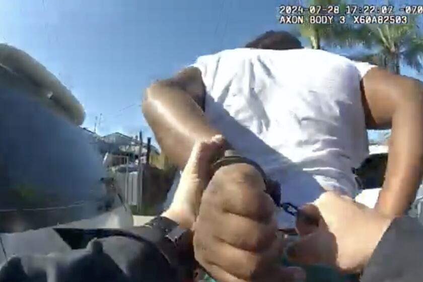 A screenshot of LAPD body cam footage showing a 17-year-old male being taken into custody.
