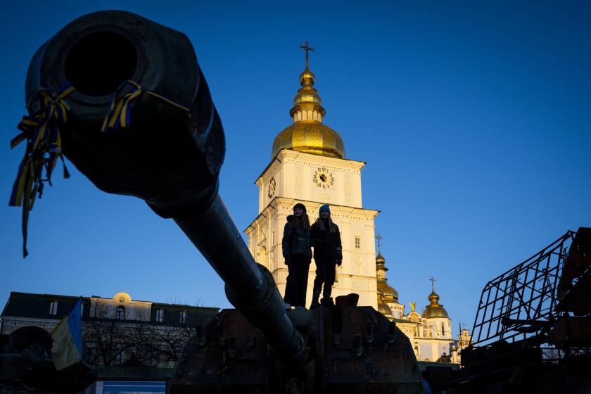 People view captured Russian equipment, including tanks, in front of St. Michael's Golden-Domed Monastery on February 12, 2023 in Kyiv, Ukraine.
