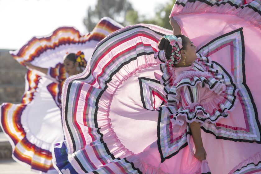 Anabella Alvarez and fellow members of the Sunshine Folkloric Ballet, from El Centro, perform during the El Grito Celebration, celebrating Mexican Independence and Mexican heritage at the Memorial Bowl in Chula Vista on Saturday, September 17, 2022.