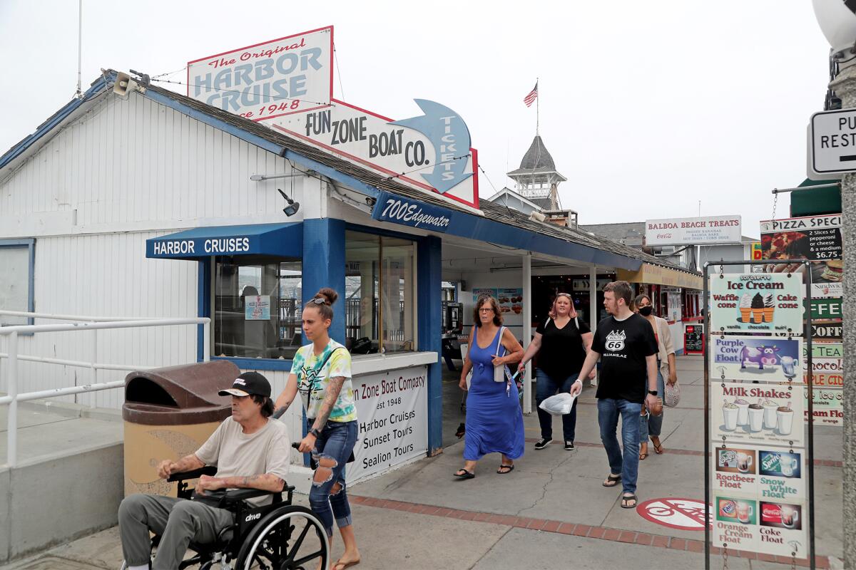 Visitors at the Balboa Fun Zone in Newport Beach on Wednesday. 