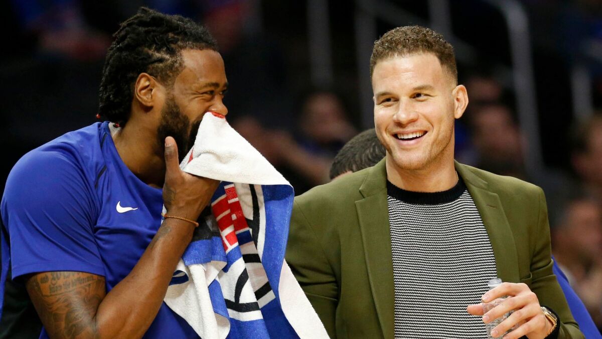 Clippers forward Blake Griffin and center DeAndre Jordan share a laugh on the bench during a Dec. 20 game against the Phoenix Suns at Staples Center.