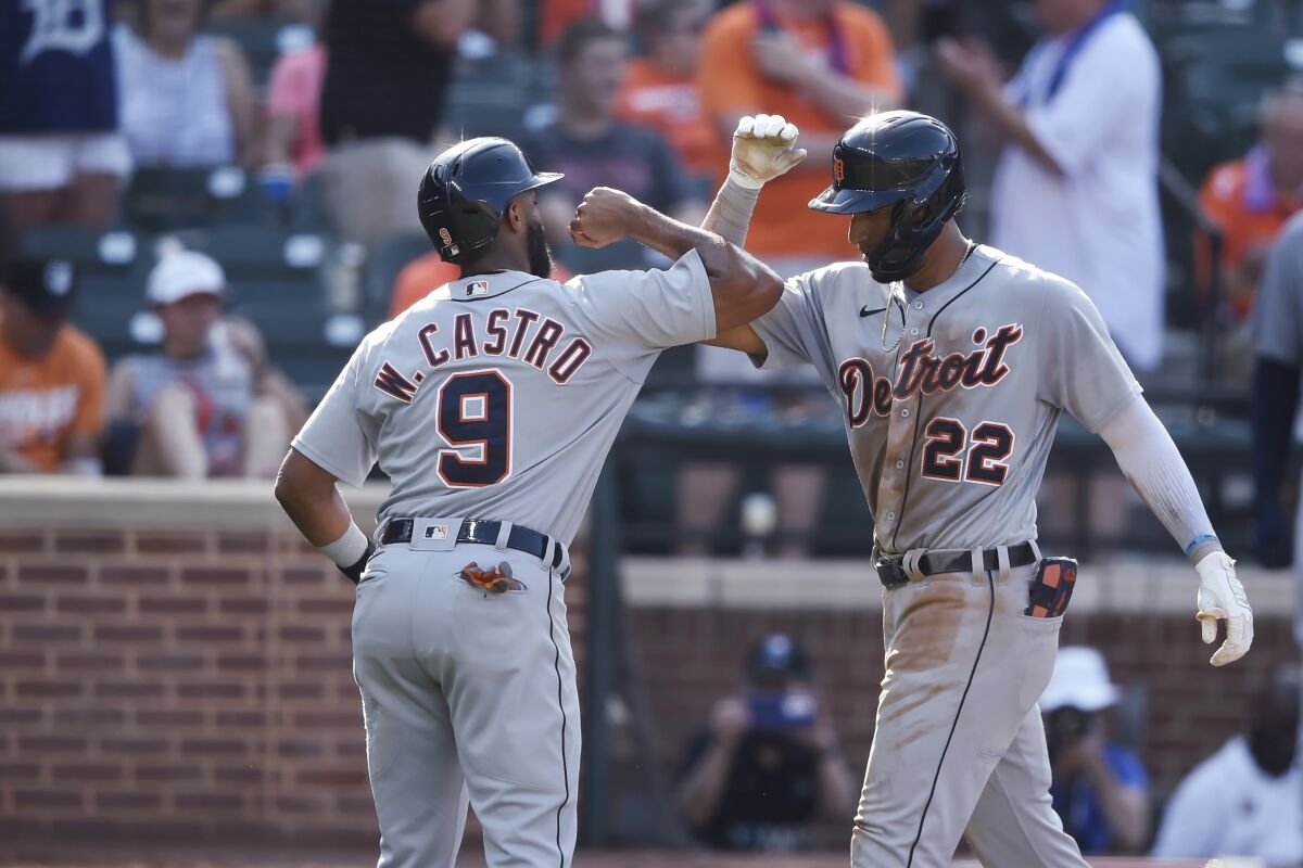 Detroit Tigers' Victor Reyes, right, is congratulated by Willi Castro after hitting a two-run home run against the Baltimore Orioles during the fourth inning of a baseball game Thursday, Aug. 12, 2021, in Baltimore.(AP Photo/Gail Burton)