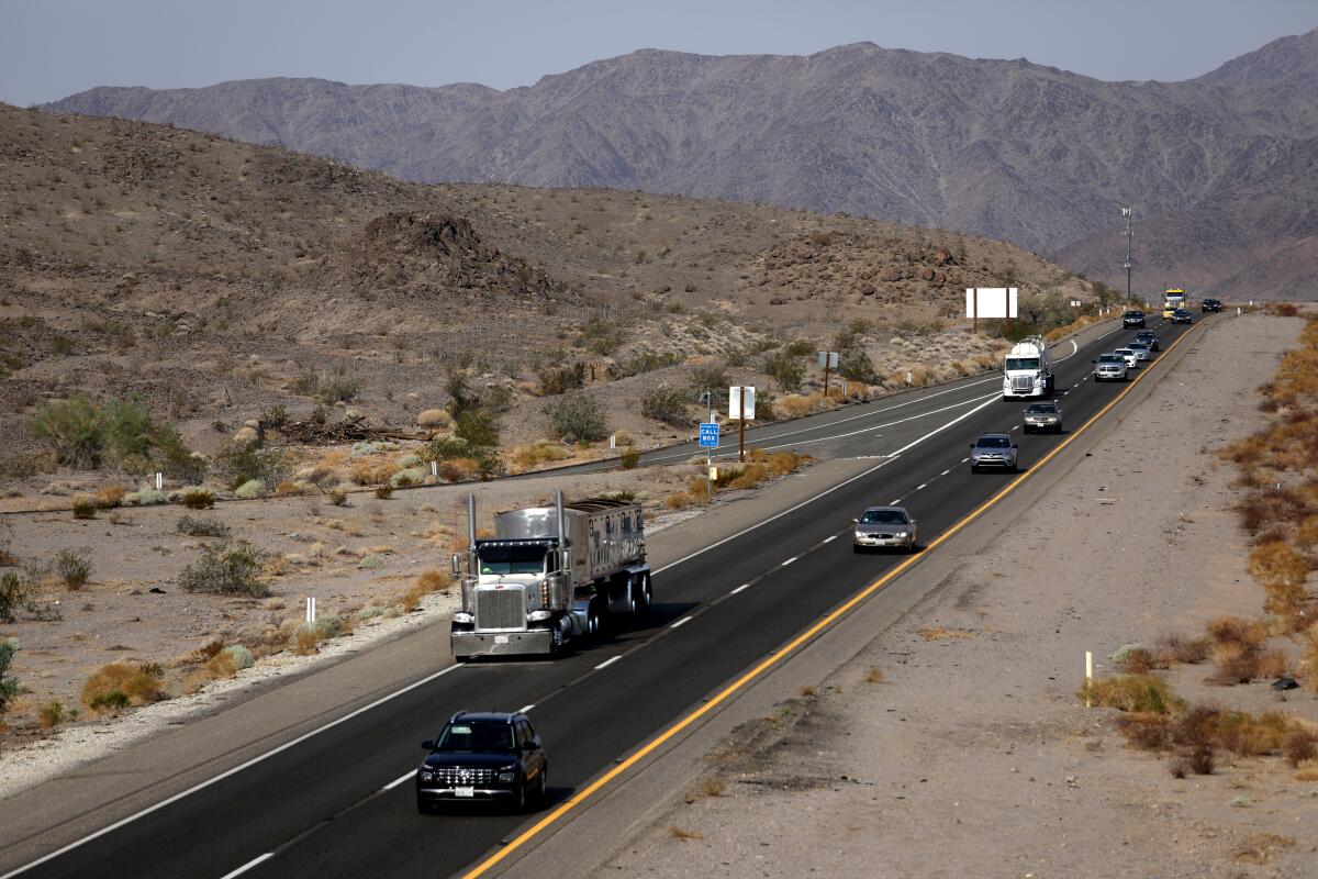 North Soda Mountains, left, along I-15 looking south, at the Zzyzx Road offramp on Aug. 19, 2021, in Baker, Calif.