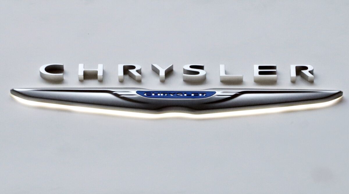 FILE - This Feb. 14, 2019 file photo shows the Chrysler logo at the 2019 Pittsburgh International Auto Show in Pittsburgh. The U.S. government is ending an investigation, Friday, April 8, 2022, into complaints of USB charging port fires in some Fiat Chrysler minivans without seeking a recall. The National Highway Traffic Safety Administration began the probe of about 170,000 minivans in August of 2020 after getting reports of three fires and one minor injury. The probe covered Chrysler Town and Country and Dodge Caravan minivans from 2013 to 2020. (AP Photo/Gene J. Puskar, file)