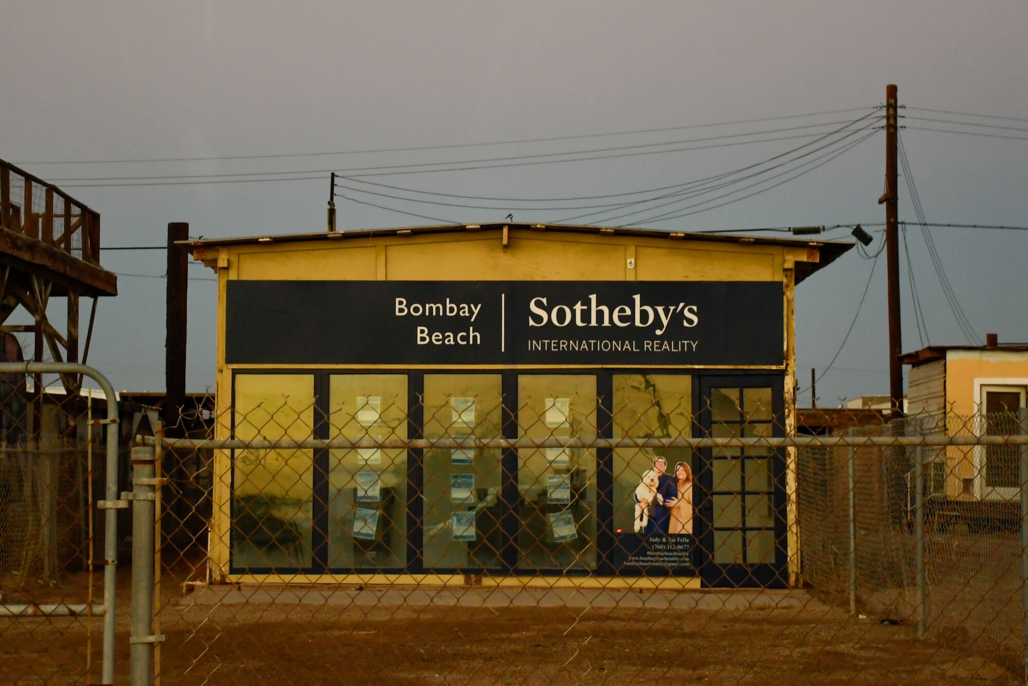 A building with a Sotheby's International Reality sign in Bombay Beach.