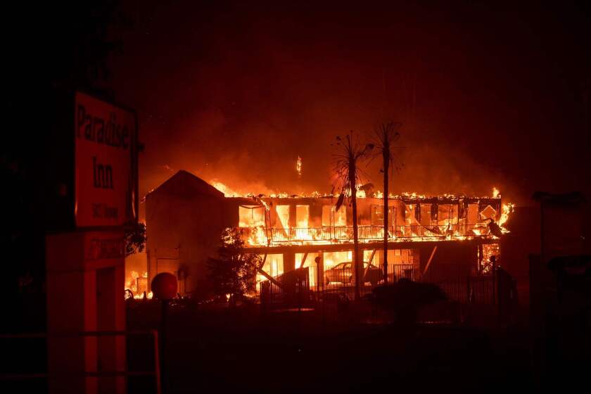 (FILES) In this file photo taken on November 9, 2018 the Paradise Inn hotel burns as the Camp Fire tears through Paradise, North of Sacramento, California. - California utility PG&E has agreed to pay $1 billion to 14 local government bodies for damage from wildfires blamed on the firm's equipment. The settlement announced on June 18, 2019 covers claims stemming from the 2018 Camp Fire in Northern California, which killed 85 people and destroyed some 18,000 buildings, and the earlier 2017 North Bay and 2015 Butte fires.In May, California's fire protection agency determined that PG&E's electrical power lines sparked Camp Fire, the deadliest in the state's history. (Photo by Josh Edelson / AFP)JOSH EDELSON/AFP/Getty Images ** OUTS - ELSENT, FPG, CM - OUTS * NM, PH, VA if sourced by CT, LA or MoD **