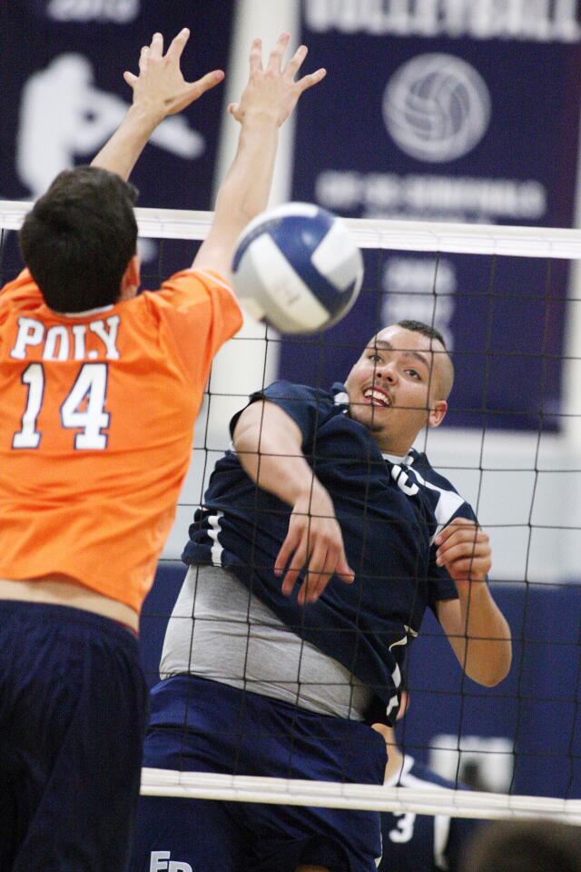 Flintridge Prep's Trip Westmoreland hits a kill against Pasadena Poly's Alex Veitch in a Prep League boys volleyball game at Flintridge Prep in La Canada Flintridge on Tuesday, May 6, 2014. Flintridge Prep won the game 3-2, winning three straight games, and finishing the season as Prep League co-leaders. (Tim Berger/Staff Photographer)