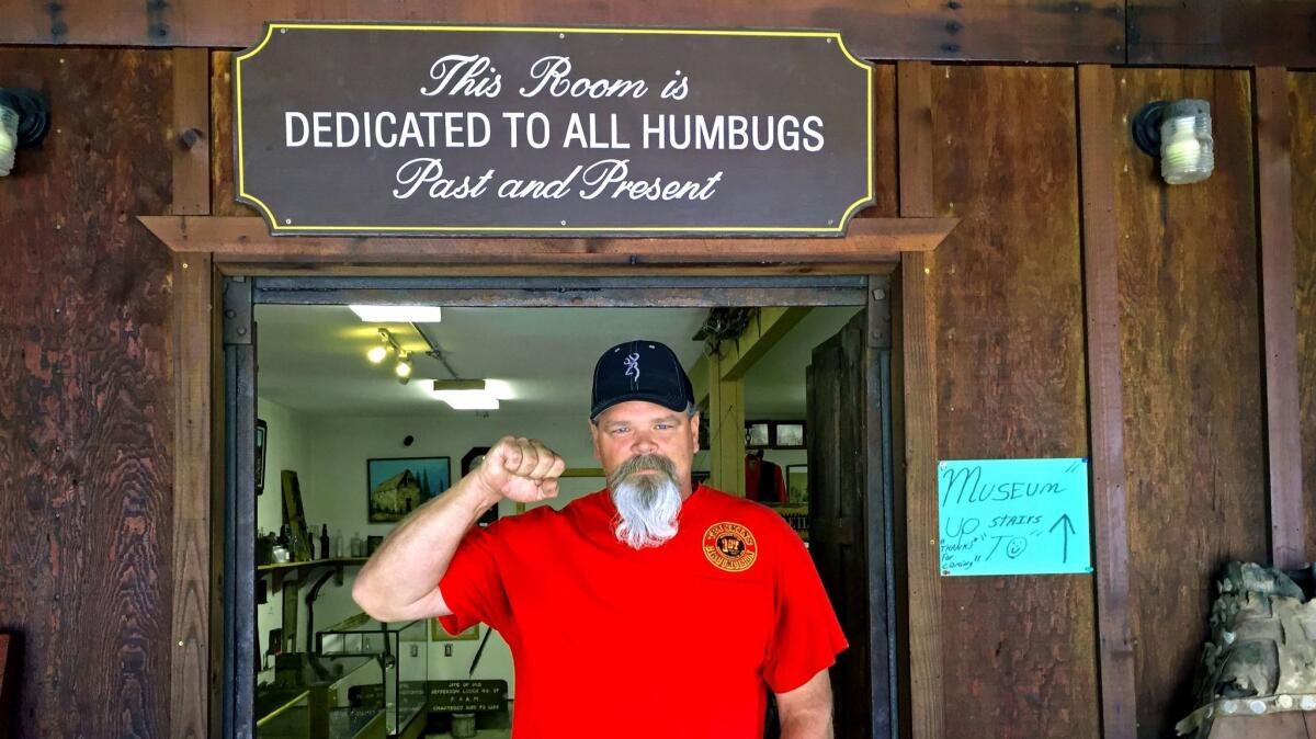 Gene Koen, who has served as a Clampers Humbug, poses outside the Frank C. Reilly Museum in La Porte, Calif.