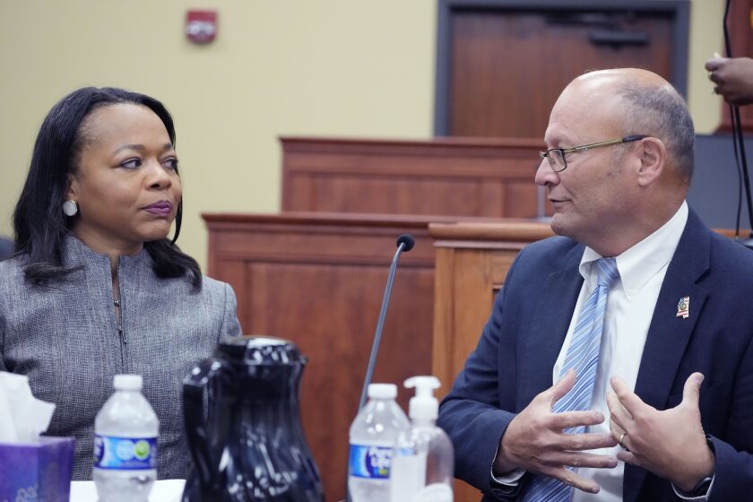 U.S. Assistant Attorney General Kristen Clarke of the Justice Department's Civil Rights Division, left, confers with U.S. Attorney Darren J. LaMarca for the Southern District of Mississippi, prior to addressing community leaders in Lexington, Miss., during a stop on the division's civil rights tour, Thursday, June 1, 2023. At each of the four stops in Mississippi, Clarke plans to engage with community leaders and reaffirm the department's commitment to protecting the civil rights of all Americans, and listen to their concerns. (AP Photo/Rogelio V. Solis)