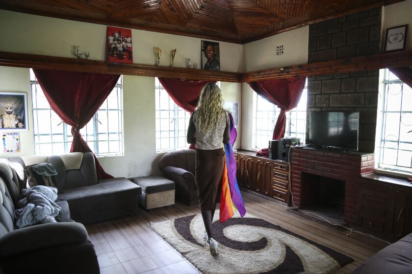 Ugandan transgender woman Pretty Peter who fled her home and country in 2019, and wished to be identified by her chosen name out of concern for her safety, poses for a photograph at the safe house where she now lives in Nairobi, the capital of neighboring Kenya Thursday, June 1, 2023. She says frightened members of the Ugandan LGBTQ+ community are searching for a way to get out of the country and some have stayed indoors since new anti-gay legislation was signed on Monday. (AP Photo/Brian Inganga)