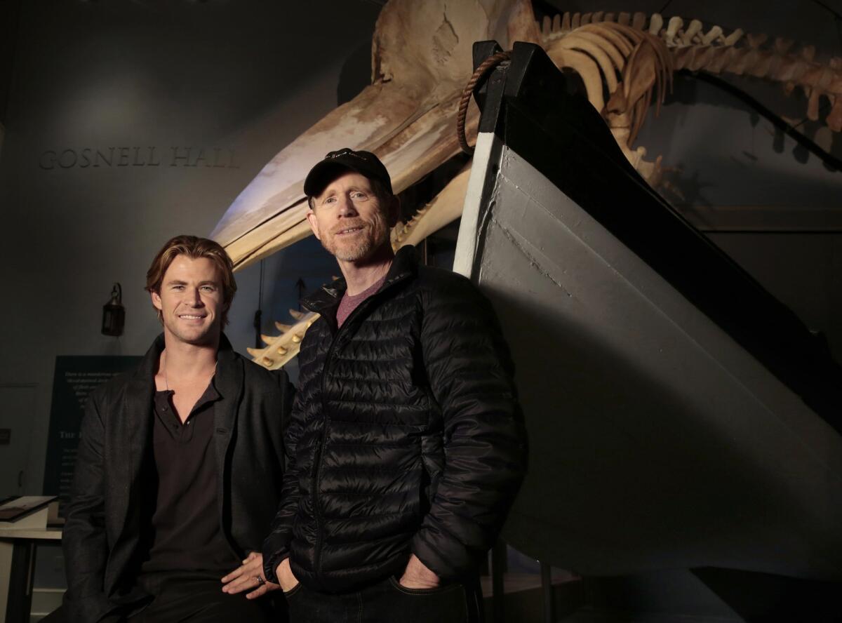 Actor Chris Hemsworth, left, and director Ron Howard worked together on "In the Heart of the Sea." The two are shown at the Whaling Museum on Nantucket Island. Behind them is the skeleton of a 46-foot Sperm whale.