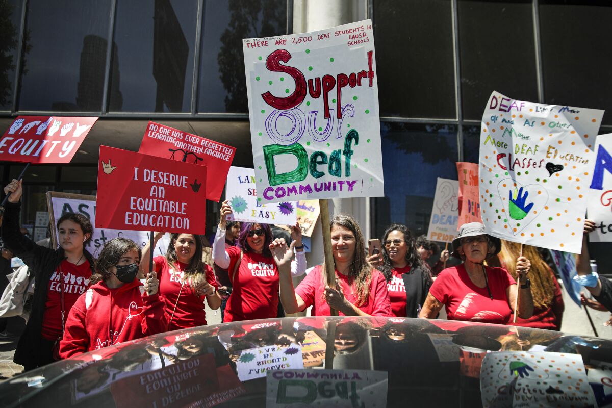 Supporters of a proposal to overhaul education for deaf and hard-of-hearing students rally outside L.A. Unified headquarters.
