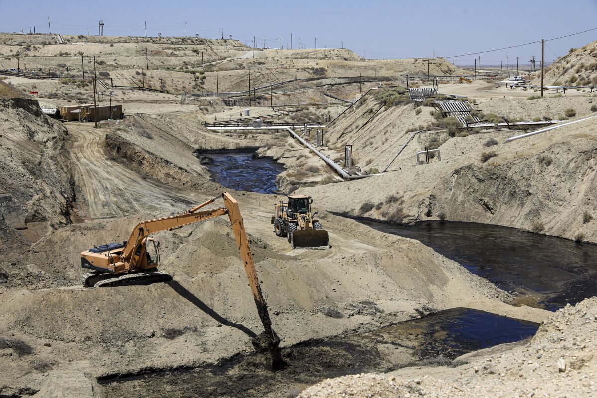 Cleanup continues on a spill at an abandoned Chevron-owned well in the Cymric oil field in McKittrick, Calif.