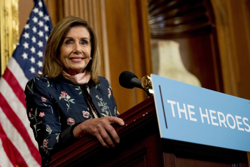 House Speaker Nancy Pelosi of Calif. smiles as she takes a question from a reporter during a news conference on Capitol Hill in Washington, Wednesday, July 15, 2020, to mark two months since House passage of "The Heroes Act" or the Health and Economic Recovery Omnibus Emergency Solutions Act. (AP Photo/Andrew Harnik)