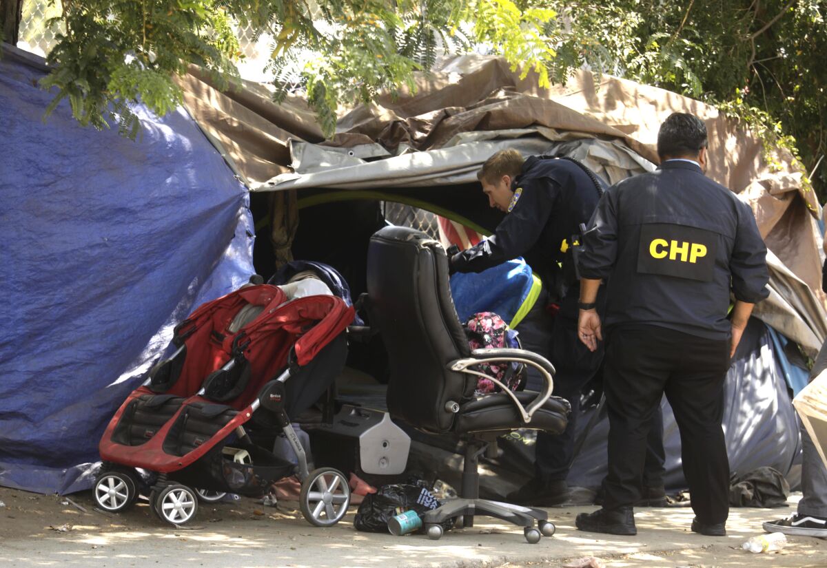 CHP officers investigate homeless encampment 