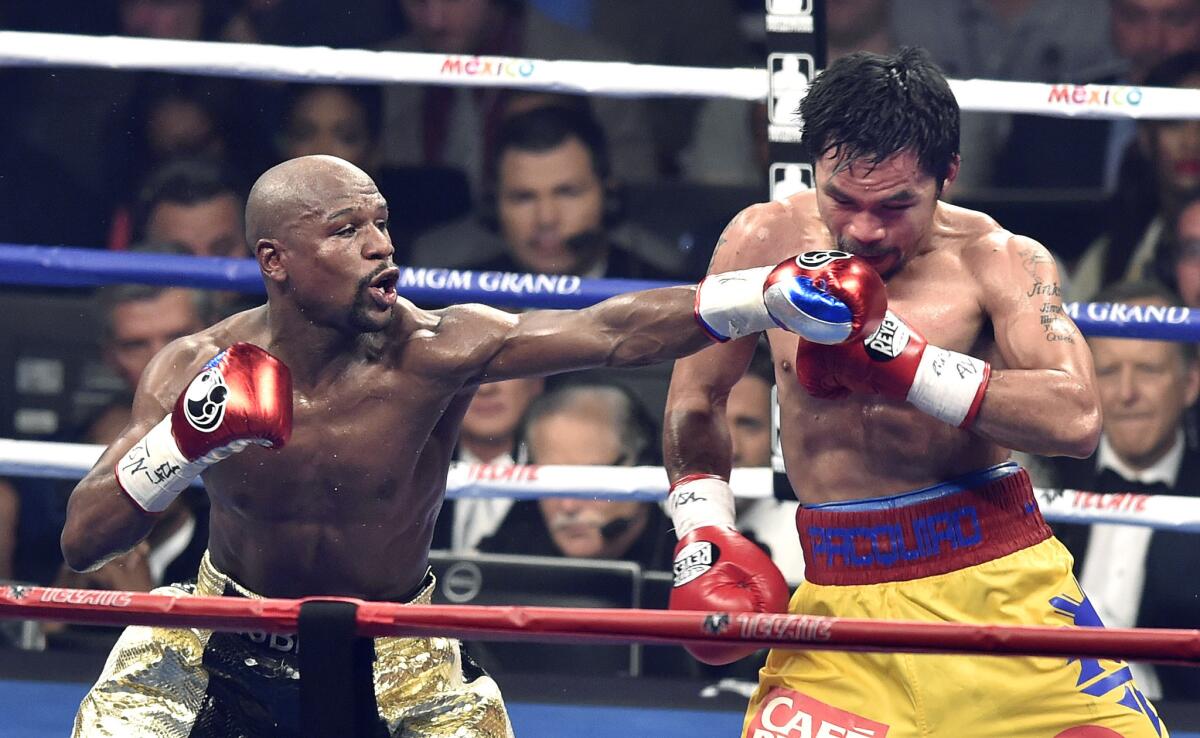 Floyd Mayweather Jr. lands a punch against Manny Pacquiao during the seventh round of their welterweight championship fight at the MGM Grand in Las Vegas on May 2.