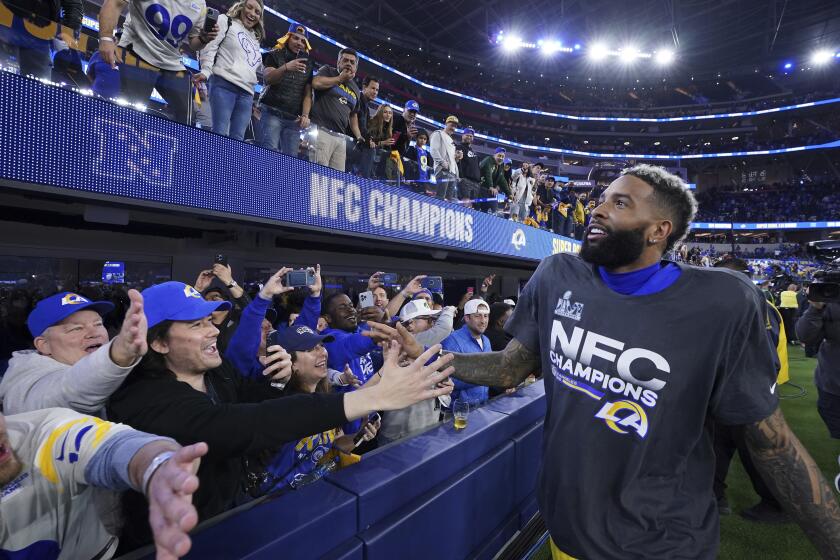 Los Angeles Rams wide receiver Odell Beckham Jr. (3) celebrates with fans after beating the San Francisco 49ers in the NFL NFC Championship game, Sunday, Jan. 30, 2022 in Inglewood, Calif. The Rams defeated the 49ers 20-17. (AP Photo/Doug Benc)