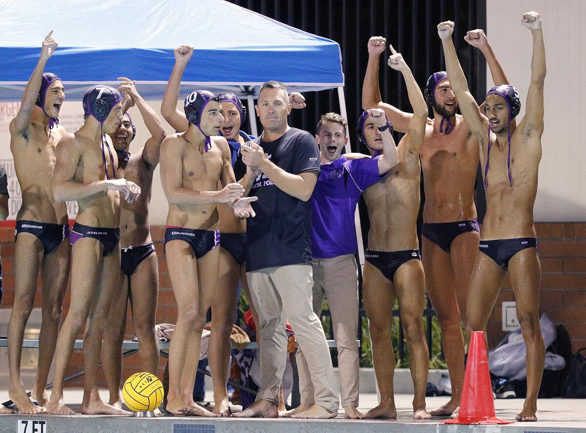 As the final seconds count to zero, the Hoover boys' water polo team, with head coach Kevin Witt, celebrate victory over Arcadia in a Pacific League boys' water polo final at Arcadia High School on Thursday, October 31, 2019. Hoover won the Pacific League title beating Arcadia 10-6.