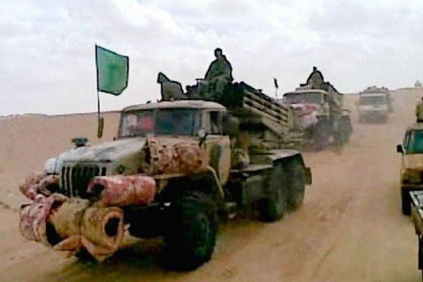 A cellphone image shows a militant convoy in the Malian desert. The French military intervention in Mali and a terrorist attack on a gas complex in neighboring Algeria have prompted debate in Washington over whether the threat warrants a military response.