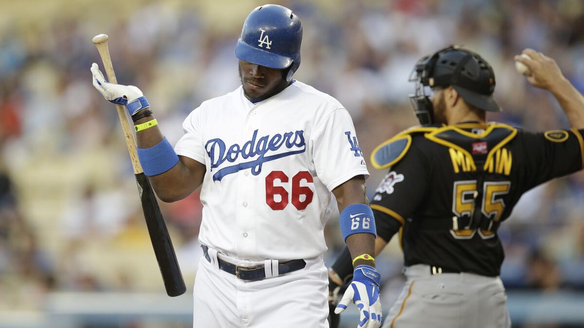 Dodgers right fielder Yasiel Puig reacts after striking out against the Pittsburgh Pirates on Friday. The Dodgers head into June in a familiar spot in the standings.