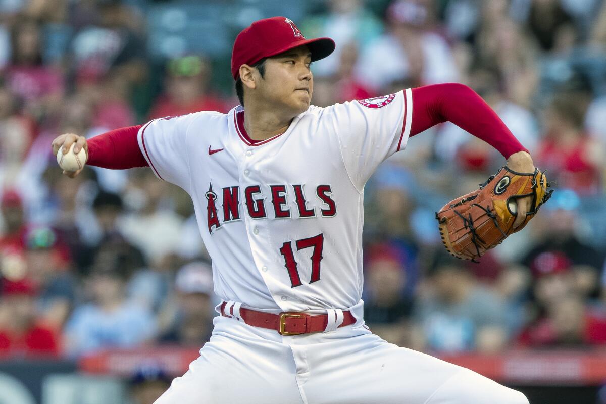 Angels pitcher Shohei Ohtani throws to a Texas Rangers batter.