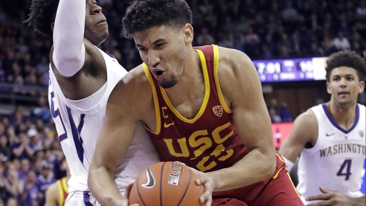 USC's Bennie Boatwright, right, tries to muscle past Washington's Noah Dickerson during the first half on Wednesday in Seattle.