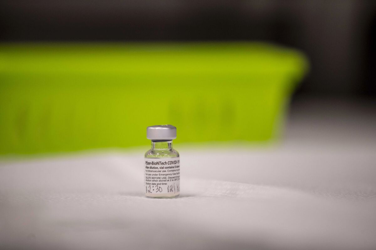 A vial of COVID-19 vaccine from Pfizer and BioNTech waits to be administered.