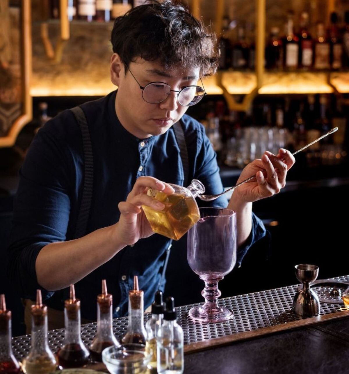 Realm of the 52 Remedies bartender Chris Lee is like a mad scientist, combining high-end spirits with homemade potions to create the innovative cocktails at the Convoy Street speakeasy. Many of Lee's flavor profiles are inspired by his upbringing in Korea. 