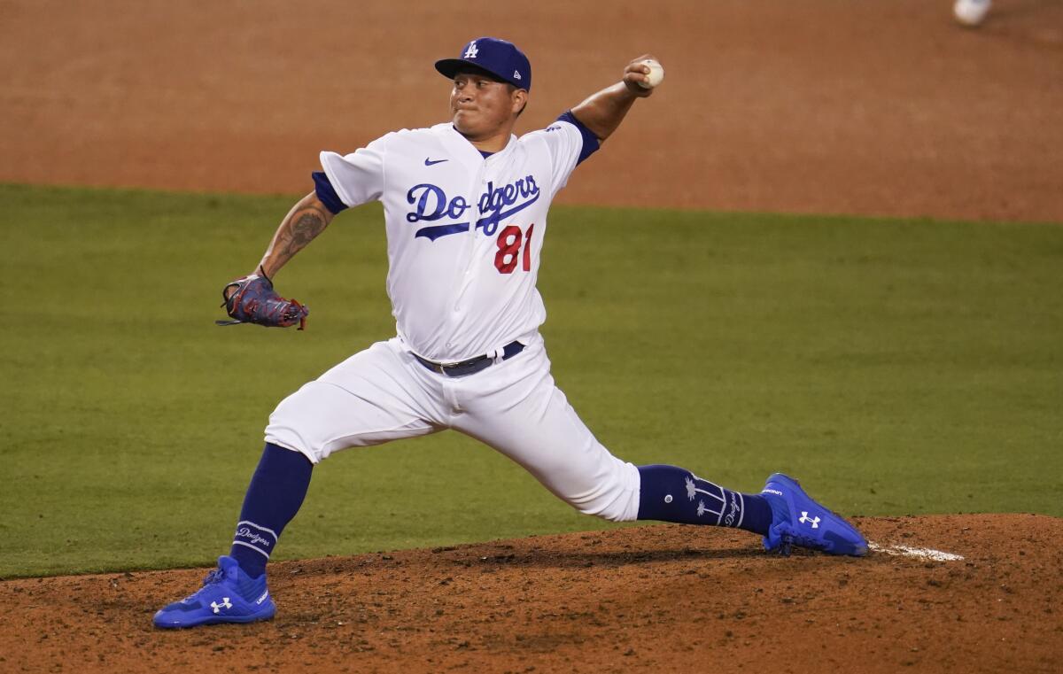 Los Angeles Dodgers relief pitcher Victor Gonzalez works in the