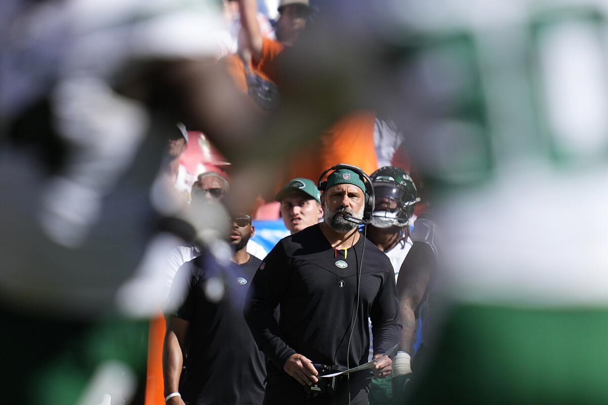 FILE - New York Jets defensive coordinator Jeff Ulbrich watches the team play against the Denver Broncos during an NFL football game Sept. 26, 2021, in Denver. Ulbrich and coach Robert Saleh expect to continue to use a rotation among their interior D-linemen, namely Quinnen Williams, John Franklin-Myers, Solomon Thomas, Sheldon Rankins and Nathan Shepherd. “Let these guys just absolutely rip it, jump off the ball, run all day long and then when they get tired, boom, you’ve got another guy to go in for him," Ulbrich said. (AP Photo/Jack Dempsey, File)