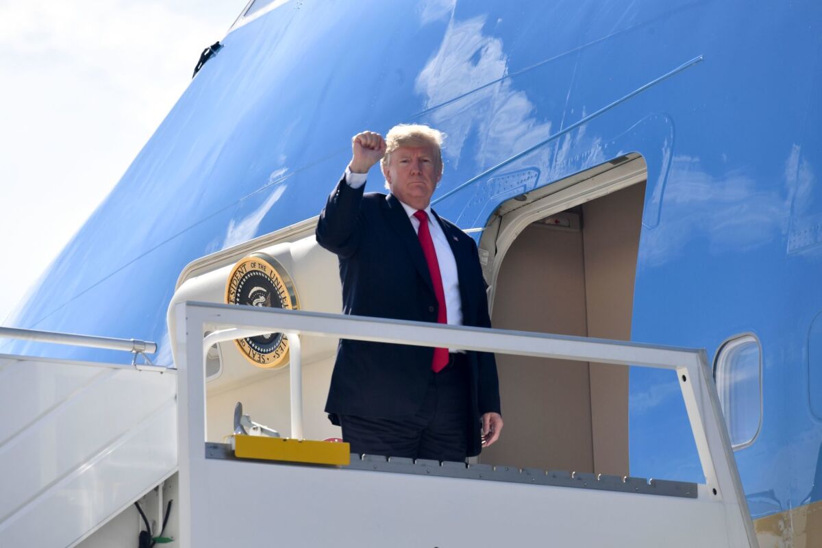 President Trump boards Air Force One on his way back to the White House from New York on Thursday.