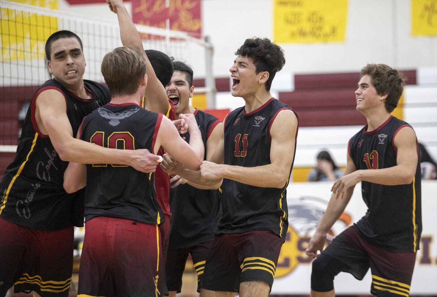 Estancia High celebrates a point in the fifth set against rival Costa Mesa during an Orange Coast League match at home Thursday.