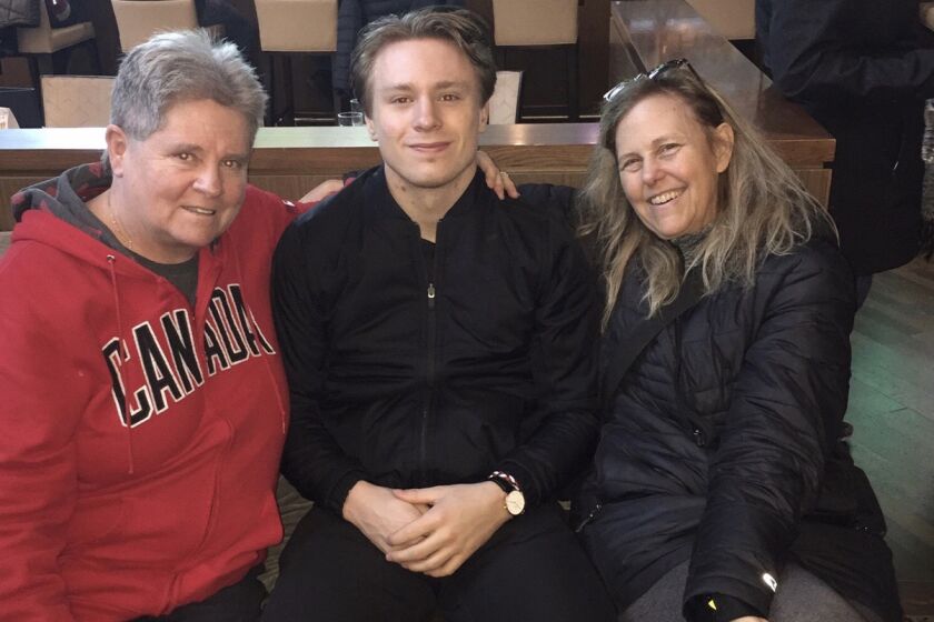 Kings hockey player Jaret Anderson Dolan and his two moms, Fran (L) and Nancy.