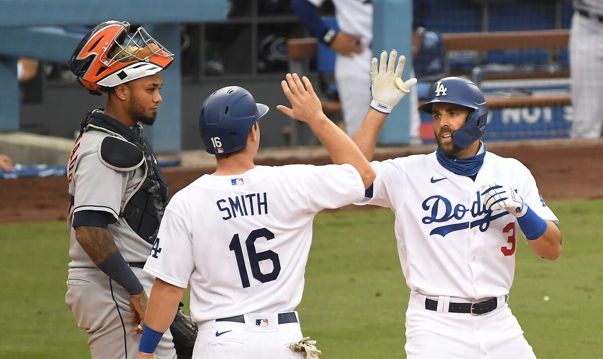 Dodgers Chris Taylor (3) celebrates his two-run home run with Will Smith.