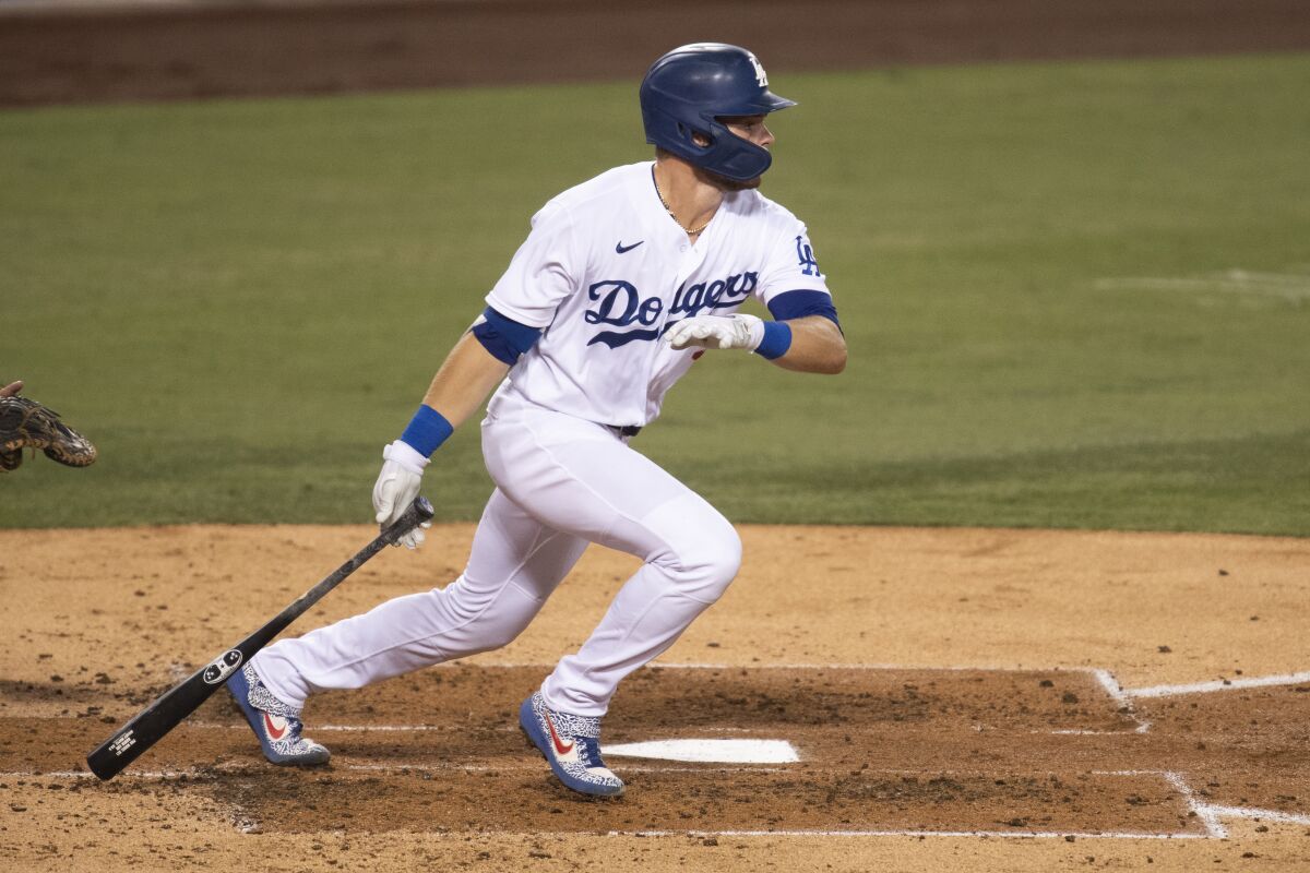 Dodgers' Gavin Lux hits against the Colorado Rockies