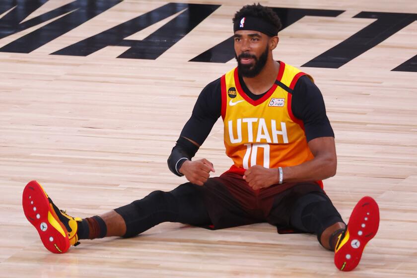 The Jazz's Mike Conley reacts after being fouled during Game 3 of a playoff series against the Nuggets on Aug. 21, 2020.