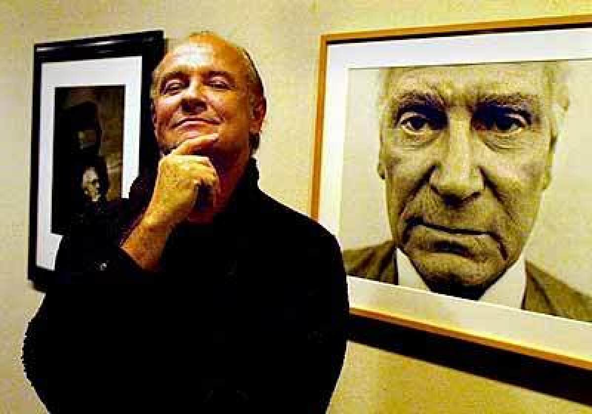 Michael Childers and his photograph of Laurence Olivier, taken in 1975. It is part of an exhibit at the Palm Springs Desert Museum.