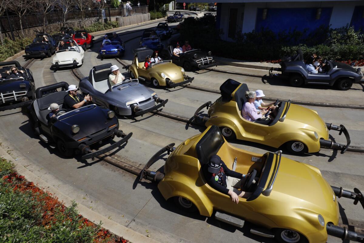 Rows of idling cars at Disneyland's Autopia.