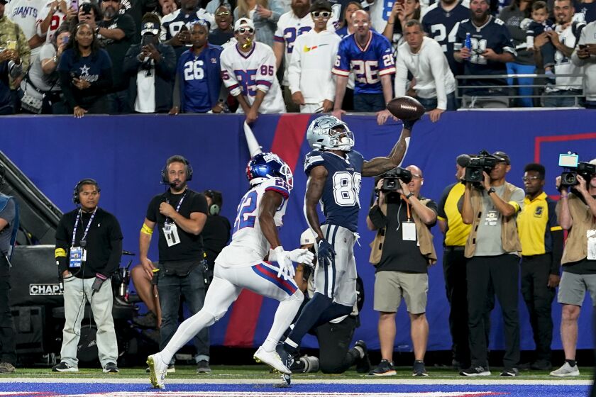 Dallas Cowboys wide receiver CeeDee Lamb (88) makes a catch in the end zone for a touchdown against New York Giants cornerback Adoree' Jackson (22) during the fourth quarter of an NFL football game, Monday, Sept. 26, 2022, in East Rutherford, N.J. (AP Photo/Frank Franklin II)
