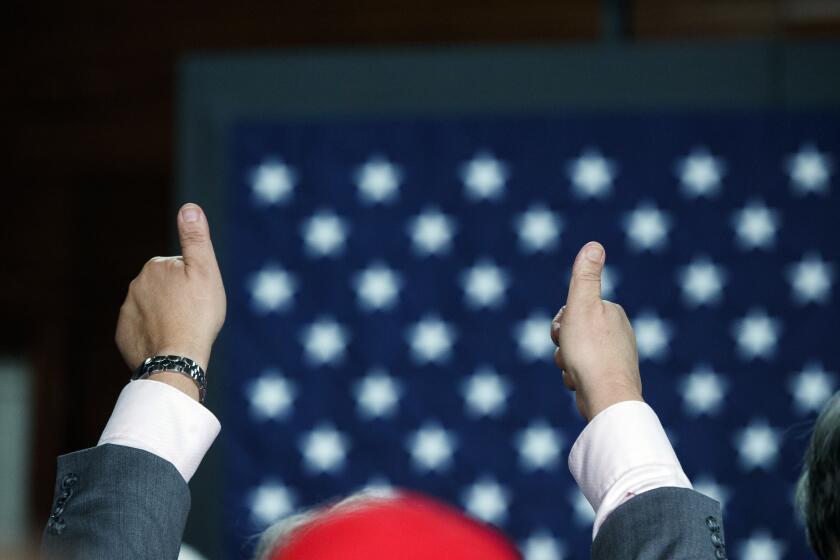 A supporter of Republican presidential candidate Donald Trump gives a thumbs during a town hall, Thursday, Oct. 6, 2016, in Sandown, N.H. (AP Photo/ Evan Vucci)